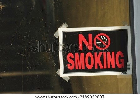 No smoking sign on business window