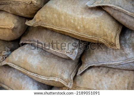 sandbag stacked closeup, protective wall against floods and bad weather