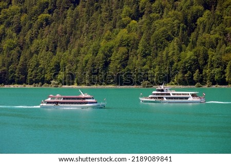 Touristic boat on the turquoise waters of Achen Lake (Achensee), Tirol, Austria, Europe Royalty-Free Stock Photo #2189089841