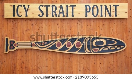 The welcome center at Icy Strait Point is decorated with a beautiful aboriginal design from the Huna Tlingit people.  This village is a popular stopping point for cruise ships. Royalty-Free Stock Photo #2189093655