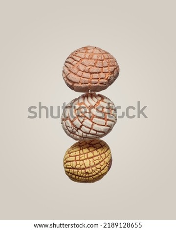 delicious mexican shells, artisan breads of three flavors, chocolate, sugar and vanilla flying in minimalist background, no people Royalty-Free Stock Photo #2189128655