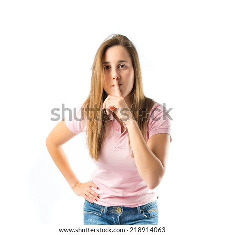 Girl making silence gesture over isolated white background