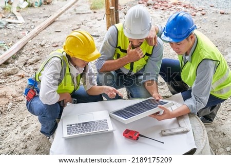 Team foreman check quality of solar cell for safe energy on construction building site