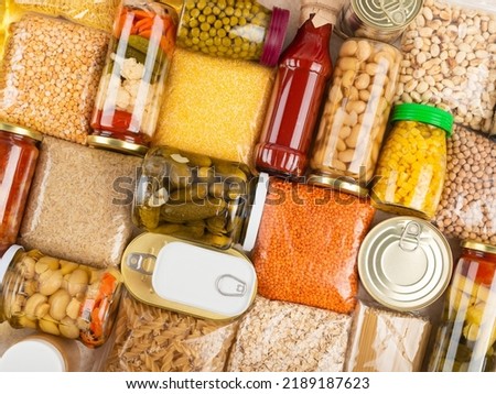 Emergency survival groceries on kitchen table closeup flat lay Royalty-Free Stock Photo #2189187623