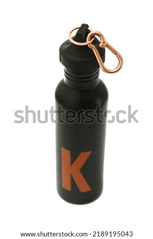 close up of a black steel thermos drinking water bottle that can be reused again. Eco-friendly thermos isolated on white background with copy space. environmental concept.