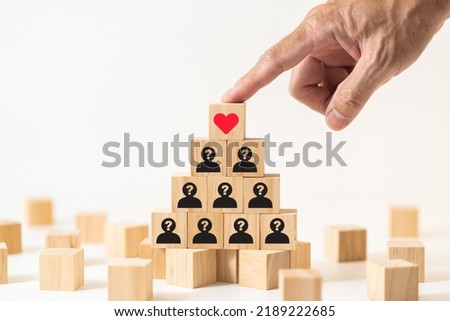 Business growth motivation for success. Hand touching wood block with business strategy icon.