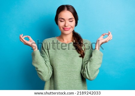 Photo of lovely pretty girl closed eyes hands fingers meditate isolated on blue color background