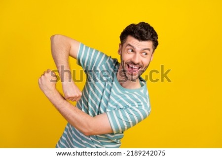 Photo of young handsome funny smiling man look for new adventures laugh dancing isolated on bright yellow color background Royalty-Free Stock Photo #2189242075