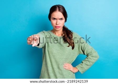 Photo of unsatisfied furious girl pointing finger camera you blame accuse isolated on blue color background Royalty-Free Stock Photo #2189242139