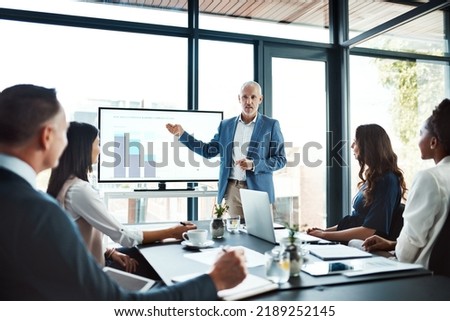 Education, training or learning on screen in business boardroom meeting to analyze data, chart or report. Manager with team of motivated executives in workshop presentation to plan vision or