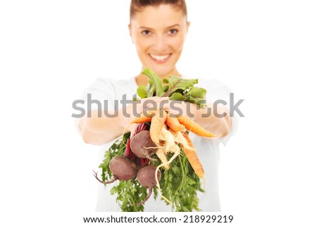A picture of a happy woman with vegetables over white background