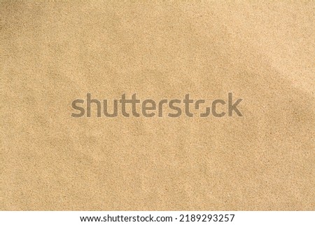 Texture of sandy beach as background, top view Royalty-Free Stock Photo #2189293257