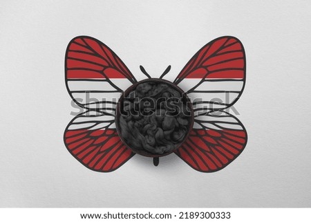Patriotic background with butterfly wings in colors of national flag. Photography and marketing digital backdrop. Austria