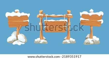 Set winter old wooden blank, signboard with snow in cartoon style.Empty frames, direction plank isolated on blue background. Season decoration