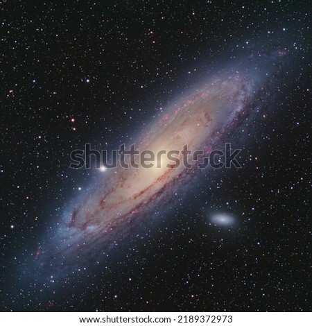 This is a photo of Andromeda galaxy (M31 catalog name). This galaxy is our closest neighbor in space. This photo combines 30 hours of RGB data and HaOIII gas emission to bring out the details.
