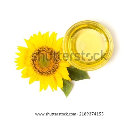 Sunflower oil and flower isolated on white, top view.