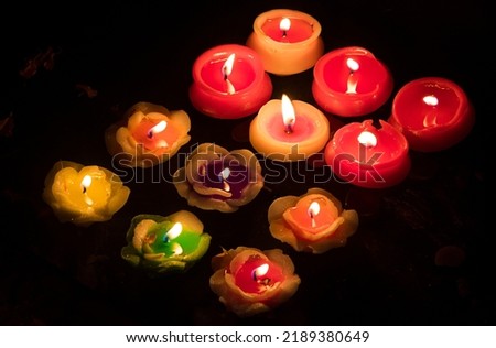 Burning Candles Against Black Background during diwali festival
