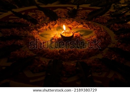 Decorated Diwali lights with colorful diya oil lamp and decorative flowers during diwali festival