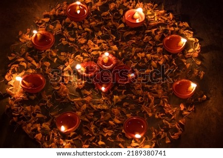 Decorated Diwali lights with colorful diya oil lamp and decorative flowers during diwali festival