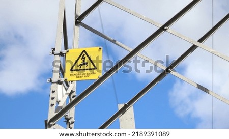 Warning danger sign on a pylon 