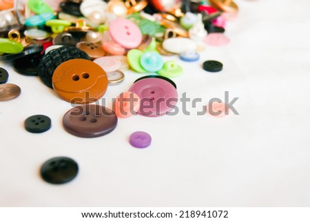 The big set of various buttons on the white
