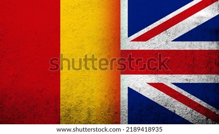 National flag of United Kingdom (Great Britain) Union Jack with The Republic of Guinea National flag. Grunge background