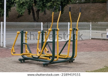 Sports equipment in public space. Outdoor public gym.