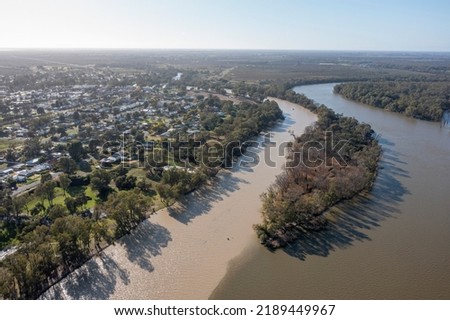 Muddy Flood waters from the  Darling river merge with the mighty Murray river at the town of Wentworth, New South Wales. Royalty-Free Stock Photo #2189449967