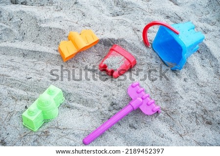 Kids beach toy set on sand . Beach bucket and spades                             