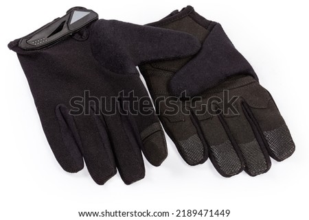 Pair of the black tactical military gloves made with textile and synthetic leathern on a white background
 Royalty-Free Stock Photo #2189471449