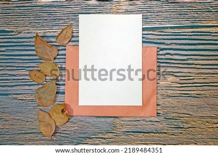 A5 Paper Greeting card mockup on wooden background