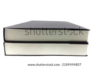 stack of two books isolated on a white background.Two black covered books. Royalty-Free Stock Photo #2189494807