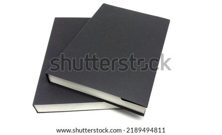 stack of two books isolated on a white background.Two black covered books.