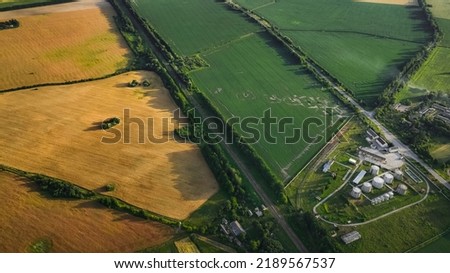 Ukrainian country side farmland agricultural fields and industry object plant, modern outskirts place view aerial photography 