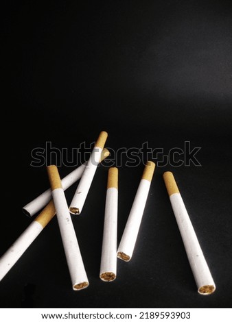 Cigarette on a black background.Bad habits.In the concept of stop smoking.