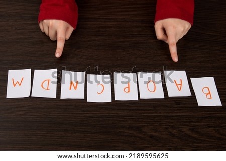 English lessons in elementary school. cards with the English alphabet. Children are learning to read. Colorful cards with alphabet for kindergarten and preschoolers. education for a small child