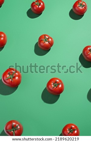 Green background pattern with red tomatoes