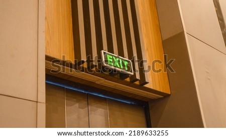 Elegant exit sign in a hotel ballroom