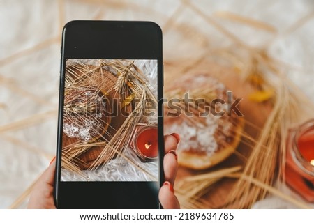TAKING A PICTURE OF FRESH BREAD
