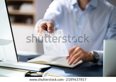 Businessperson Hands Giving Cheque To Other Person Royalty-Free Stock Photo #2189637857