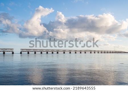 The clouds above the broken bridge off of Bahia Honda State Park looked as if they were making an "Okay" hand signal and the soft reflections in the foreground allow the viewer to see the scale.