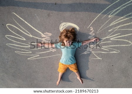 Happy angel child, childhood concept. Funny kids. Creative leisure. Little angel. Smiling boy having fun. Happiness. Boy with painted wings. Valentines day infant, Little Valentine boy.