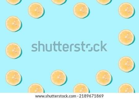 Ripe lemon slices on mint background - creative summer pattern - harvest concept