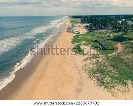 drone shot aerial view top angle seascape turquoise blue water sea ocean beach coastal waves natural scenery wallpaper background india tamilnadu 