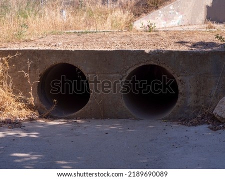 drainage pipe in the middle of a forest. Pollution concept.