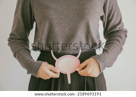 Woman holding bladder, cystitis, urethritis and Urinary Incontinence, bladder cancer concept Royalty-Free Stock Photo #2189693191