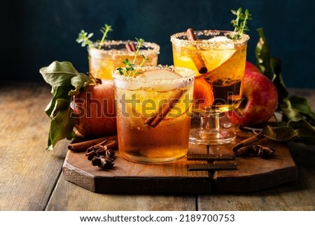 Apple cider margarita with brown sugar rim, cinnamon and fresh thyme, fall cocktail or mocktail idea in a rustic setting Royalty-Free Stock Photo #2189700753