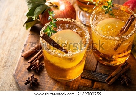 Apple cider margarita with brown sugar rim, cinnamon and fresh thyme, fall cocktail or mocktail idea in a rustic setting Royalty-Free Stock Photo #2189700759