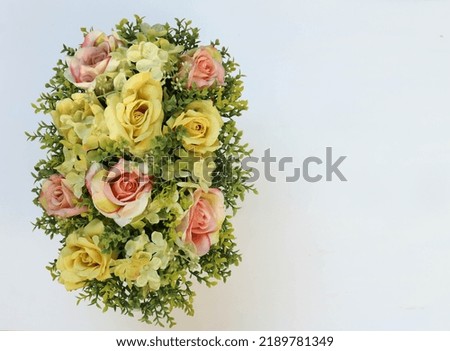 imitation flowers for decoration, top angle view and white space