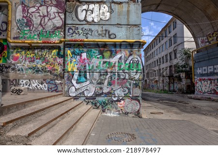 Beautiful street art graffiti. Abstract creative drawing fashion colors on the walls of the city. Urban Contemporary Culture Royalty-Free Stock Photo #218978497